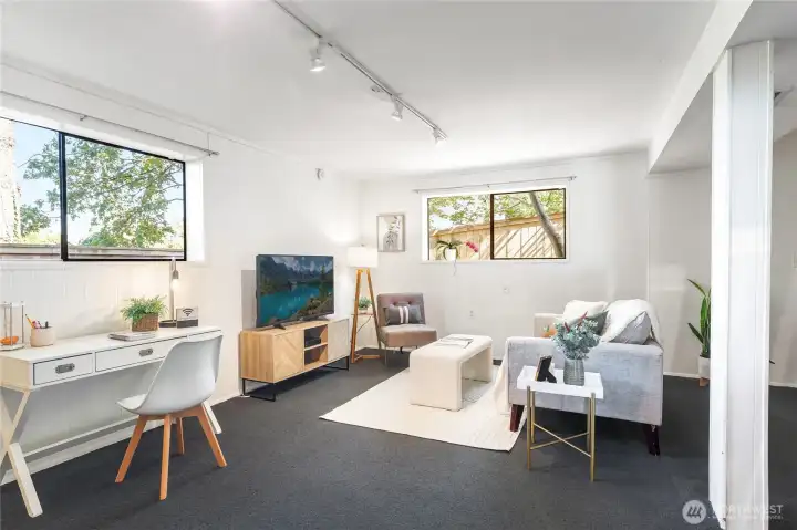 Garden Level with expansive living/dining zone, full-size windows with garden outlooks, spacious bedroom, bath, abundant storage, and private entry—flexible as guest suite, office hub, or potential ADU.