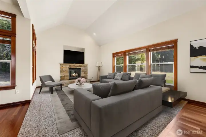Virtually staged family room. Gas fireplace.