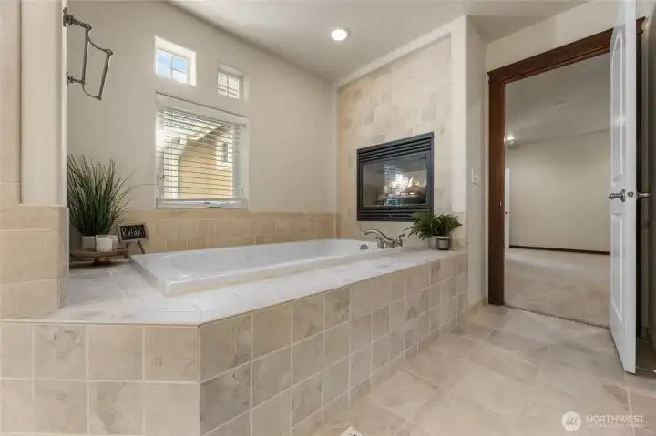 Beautiful jetted tub with cozy fireplace