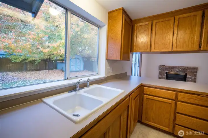 Kitchen with Large window to back yard