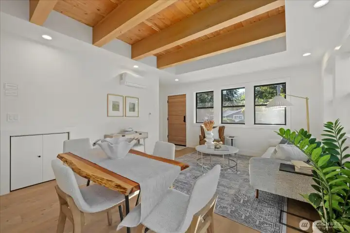 Living room.  Powder room under the stairs.  Garage door on the right hand side.