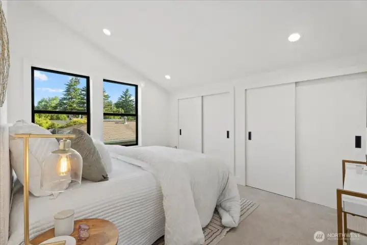 2nd upstairs bedroom; contains tons of storage along the far wall.  All upstairs bedrooms have their own mini-split head unit.