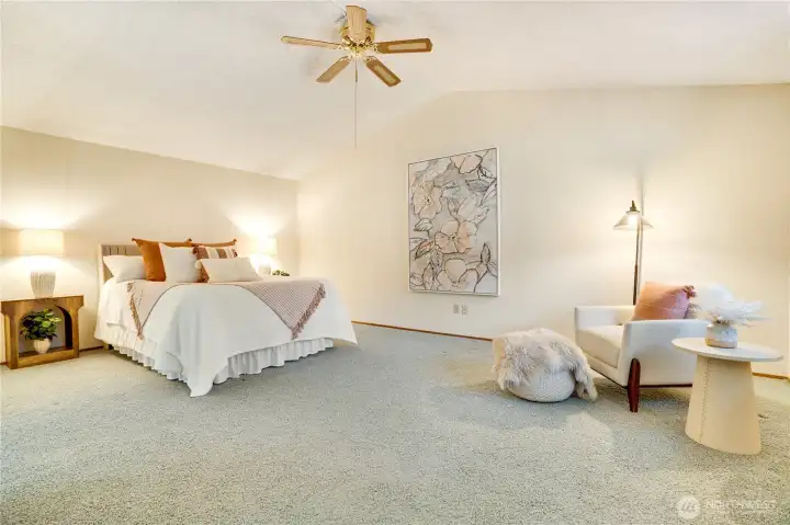 This expansive primary suite gives you options for your California King, dressers and a cozy reading space if you wish.  Private bath with shower and large walk-in closet are yours as well..
