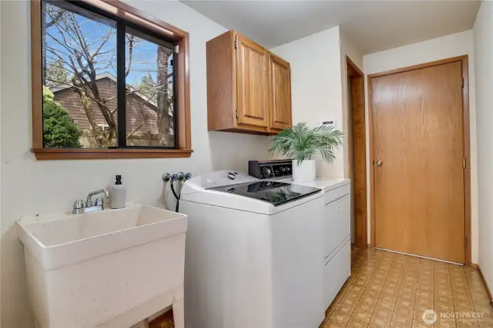 Swoon for this mudroom off of the garage!  Extra storage and place to store shoes and backpacks.