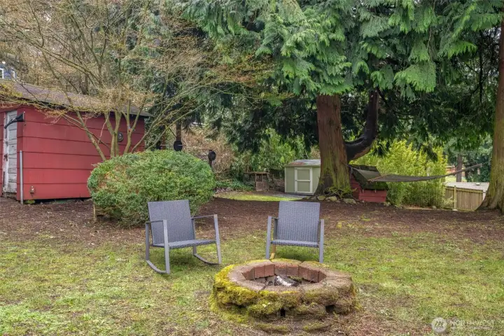 Fire pit, shed, new Tuff shed, hammock and room for many off-street parking spaces.