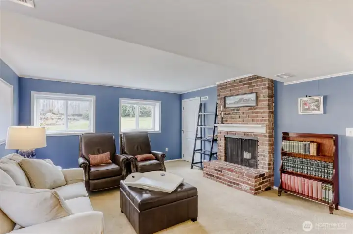 Cozy family room with fireplace, ideal for relaxing.