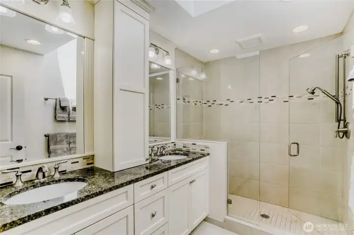 Luxurious primary bath with a dual sink vanity and a large step in shower.