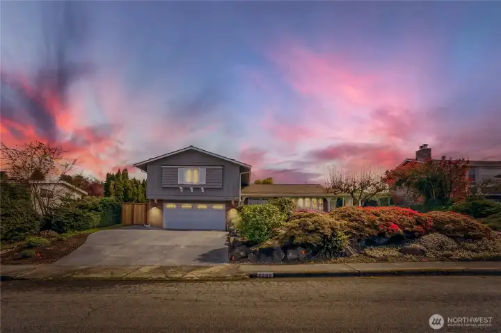 Twilight view of front exterior.
