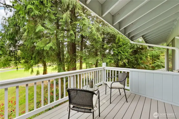 Here's your partially covered, weather-resistant deck with a beautiful view of the golf course and native Cedar trees.