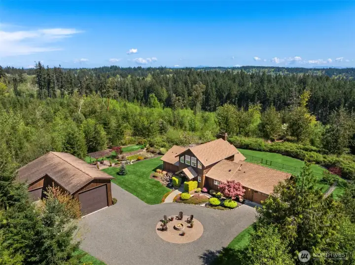 The welcoming entry courtyard creates a sense of having arrived. It provides ample room for parking, turnaround (of even the larges vehicles), and gathering around the fabulous fire pit.