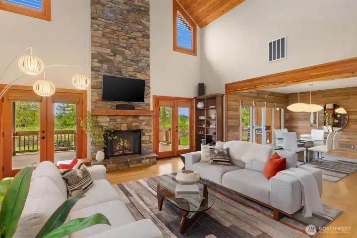 The east wall of the living spaces is almost entirely glass, creating a sense of connection to nature and the view of Rainier and the Cascade Mountains (when they grace us with their presence).