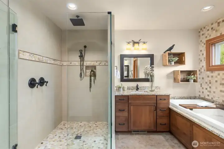 Another view of the shower, showing the rain shower and wall-mounted wand. It’s the little luxuries that make a home special.