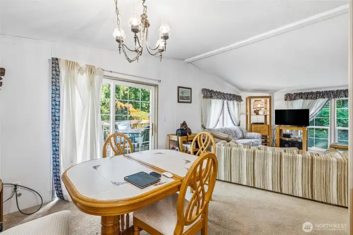 Dining area with slider to large deck.