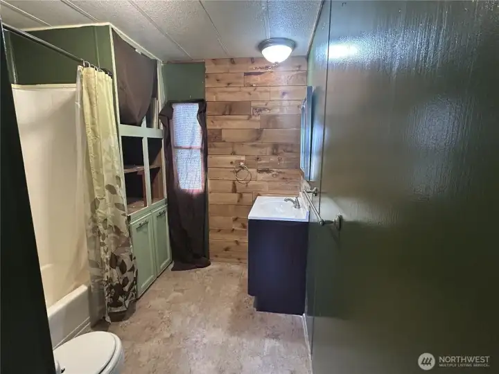 Well sized full bath with storage built in!