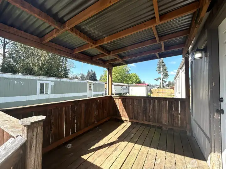 Lovely covered deck off front entrance. Offers the perfect spot to enjoy the outdoors year round!