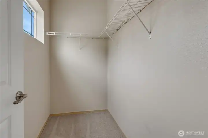 Walk-in closet offering ample storage space with easy organization and accessibility.