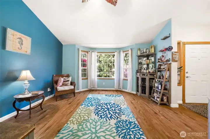 Vaulted ceilings, bay window, new LVP flooring!