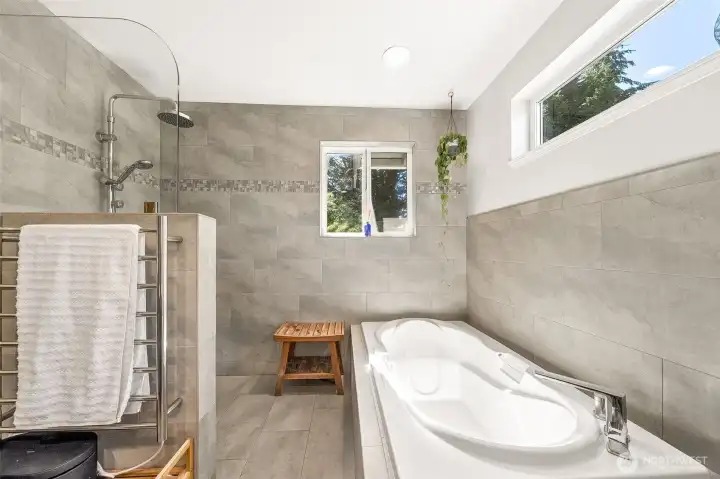 Primary bath with floor to ceiling tile
