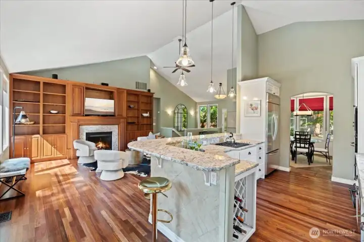Gather with family and friends in the stunning great room, where custom cabinetry, hardwood flooring, and a gas fireplace create the heart of the home.