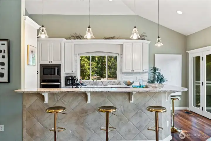Large kitchen island with seating for four—perfect for casual dining and gathering.