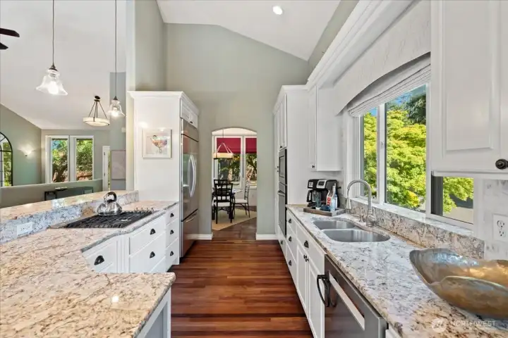 From the kitchen's quartz counters and stainless steel appliances to the great room's custom built-ins and fireplace, every detail has been thoughtfully designed for comfortable lakefront living.