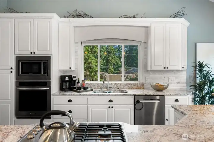 Perfect for entertaining, the kitchen opens directly to the spacious great room, creating an ideal space for hosting guests or enjoying quiet evenings at home.