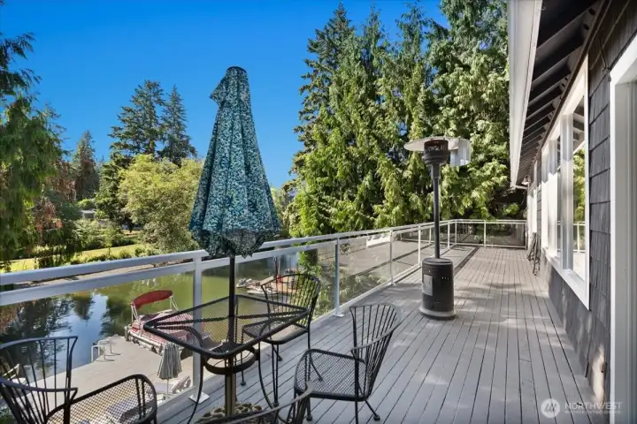 Expansive deck off the kitchen provides the ideal setting for outdoor dining and relaxation.