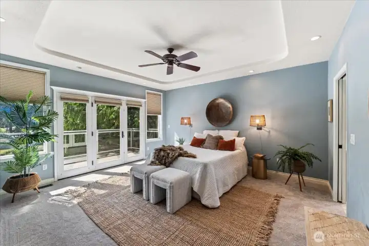 There is plenty of natural light from the french doors and large windows making this primary suite light and bright.