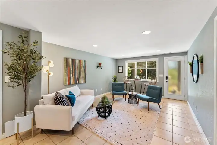 Lower level bonus room offers flexibility for a media room or additional living area with direct access to the lower patio and just a few steps from the lake.