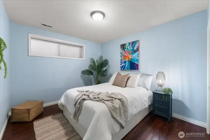 One of the two bedrooms on the lower level with hardwood flooring and generous size closet.