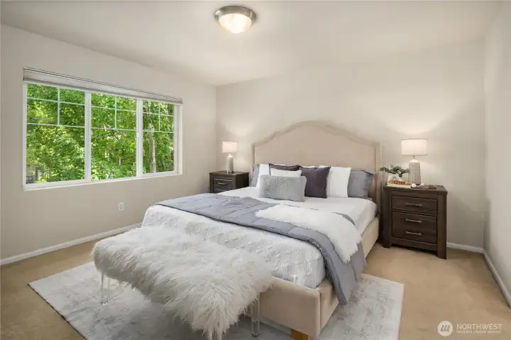 Spacious primary suite, complete with a   5-piece bath and an extra-large walk-in closet.
