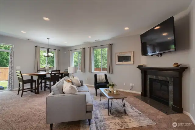 Open concept living with recessed lighting, TV over gas fireplace to enjoy entaining year round.