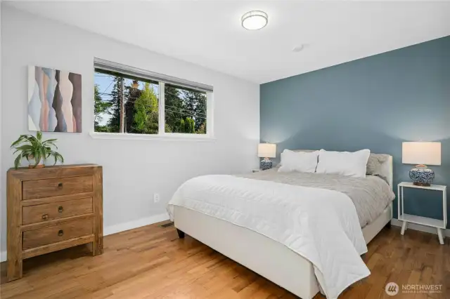 Main level bedroom overlooks front yard.