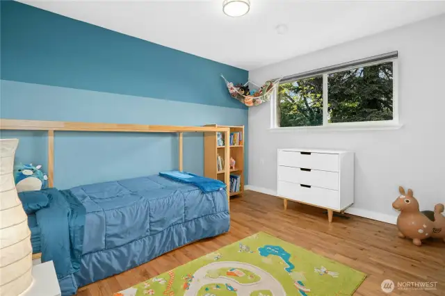 This bedroom overlooks backyard.