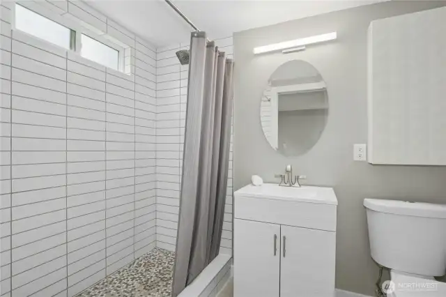 Updated lower level bathroom attached to primary suite.
