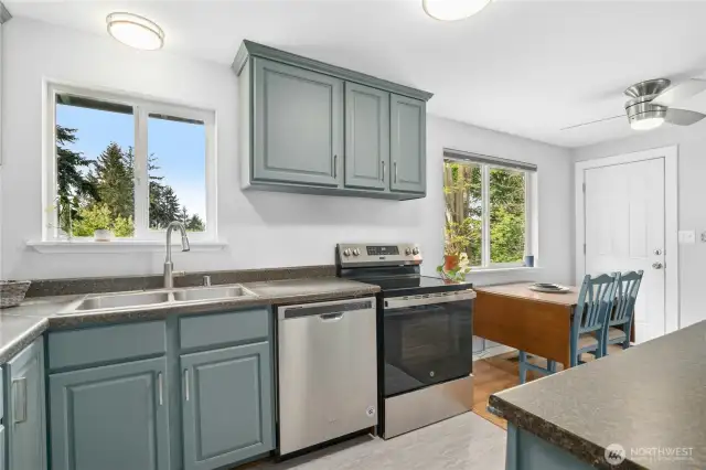 Kitchen and dining room overlook backyard