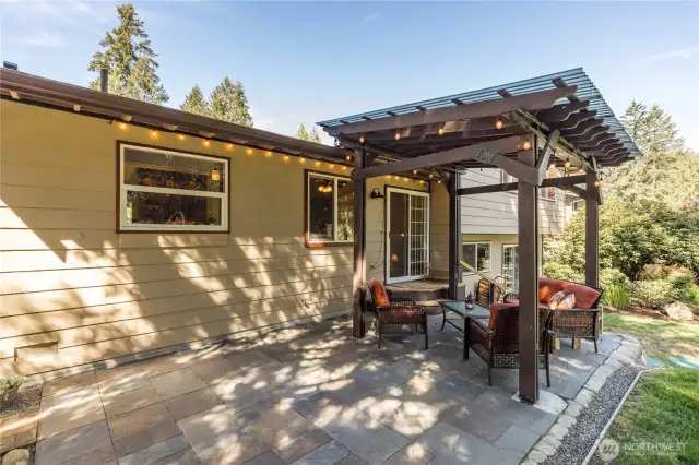 Lovely patio with a covered portion for year-round outdoor enjoyment