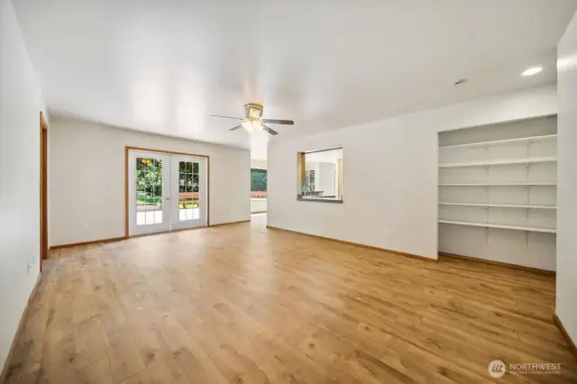Family room with built-ins and french doors to deck