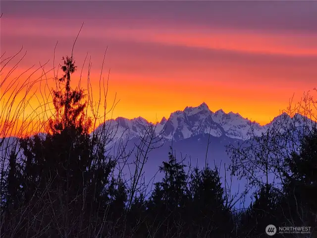 A zoomed view of the Olympic mountains at sunset from the house.