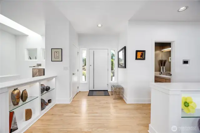 The front entry says it all:  Quality, classy, efficient, perfection. The wall niches add architectural interest and can showcase your treasured artwork, statues, pottery, books, and more.