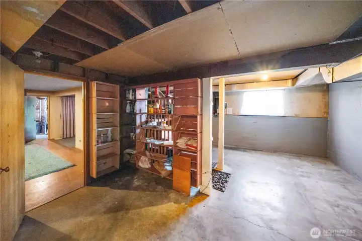 tear wall down and relocate stairs like other renovations. Add slider out to backyard of window