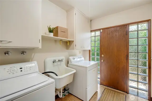 Laundry room behind kitchen.