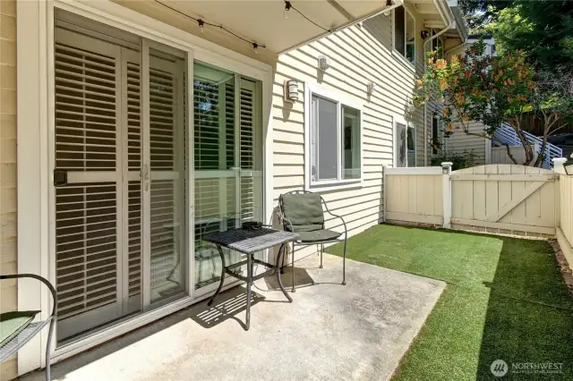 Wonderful patio with turf for easy maintenance and a fun space for your fur babies! Gate leads out to the greenspace for more playtime!