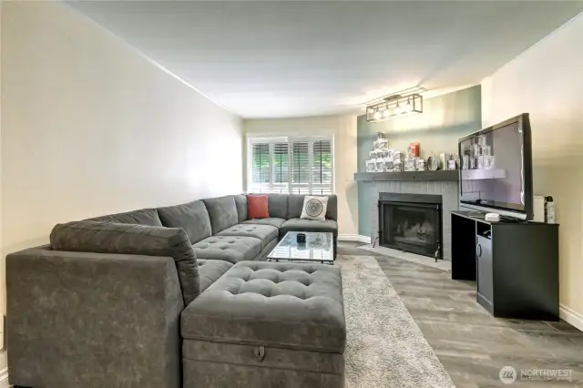 Wood burning fireplace and over mantle display lighting.