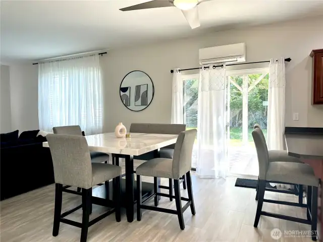 Dining area space connecting to living area + patio access.