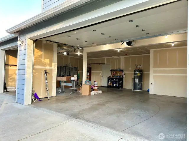 Garage with man door to the back yard makes working on projects easy and convenient!