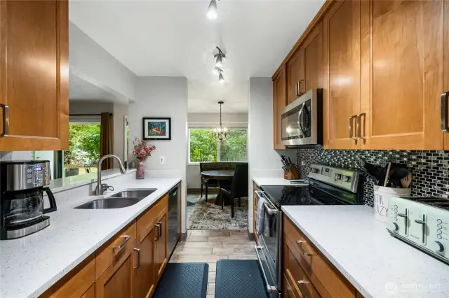 Custom solid wood cabinetry for ample storage.