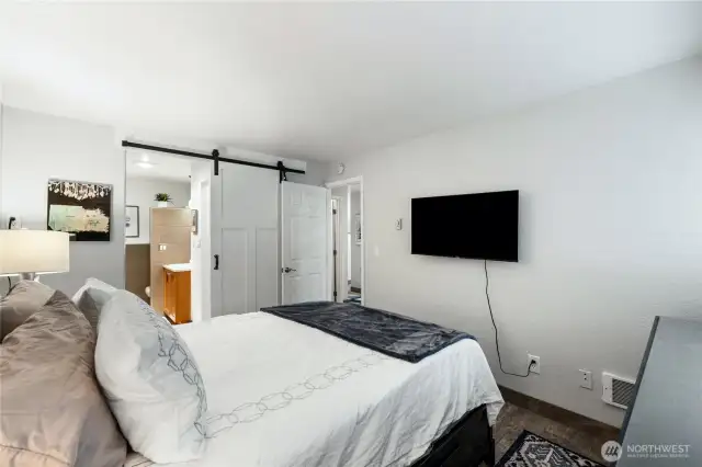 The primary suite is designed for comfort and privacy.