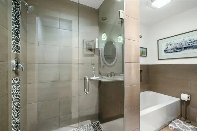 Luxurious walk-in shower with modern finishes.
