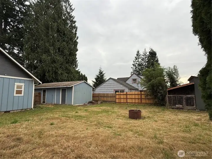 Large, fenced backyard with chicken coop